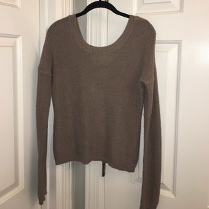 Stylish sweater blearily worn
