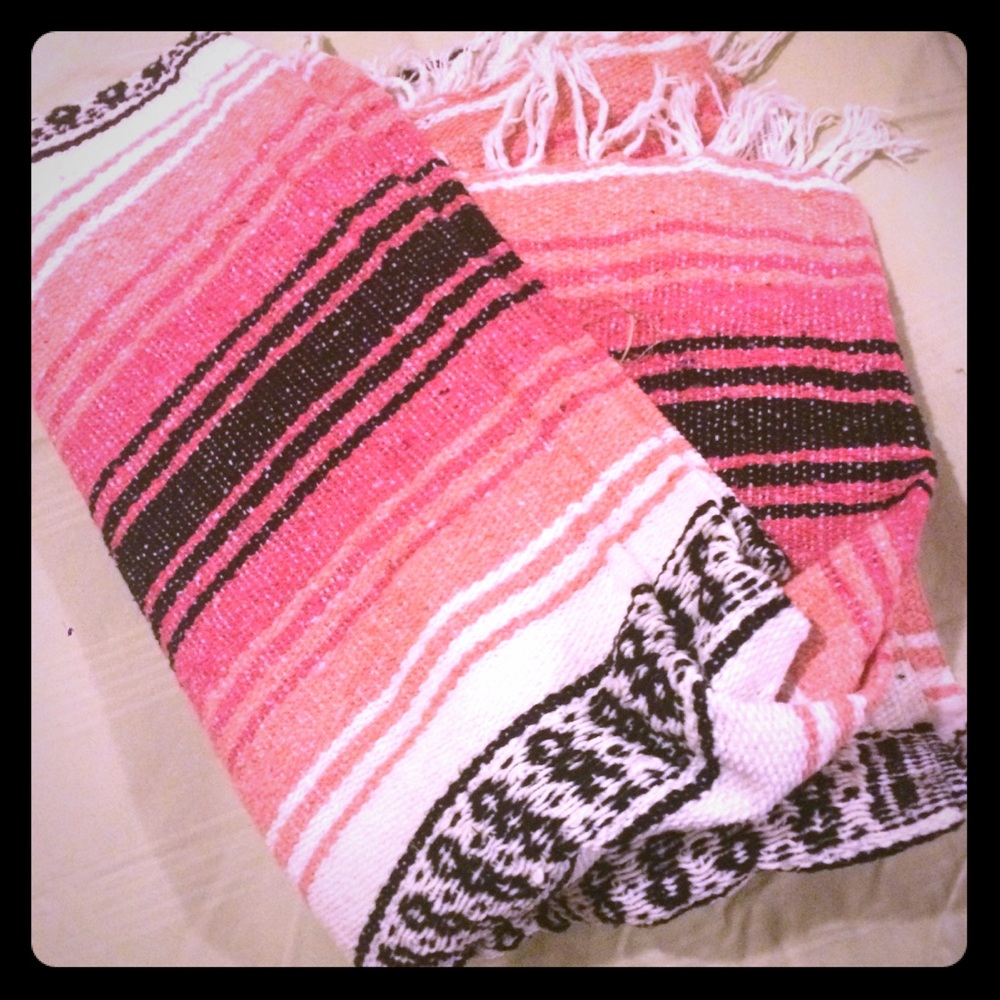 Pink, coral, black, and white Mexican blankets