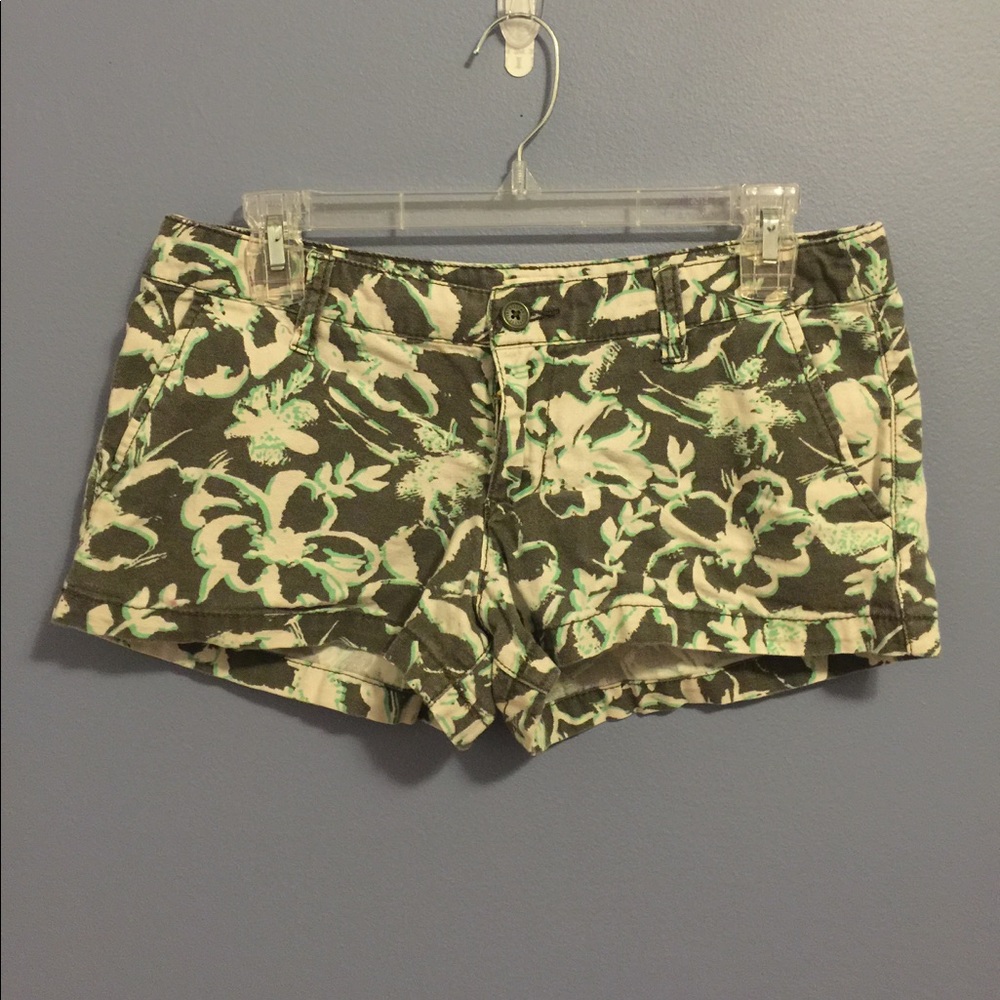 Gray, green, and beige floral print shorts