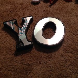 Mirrored "YO" sign, black trim.