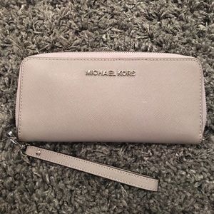 MK- Jet set travel continental wristlet