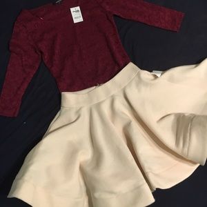 Red flower lace shirt and cream skirt