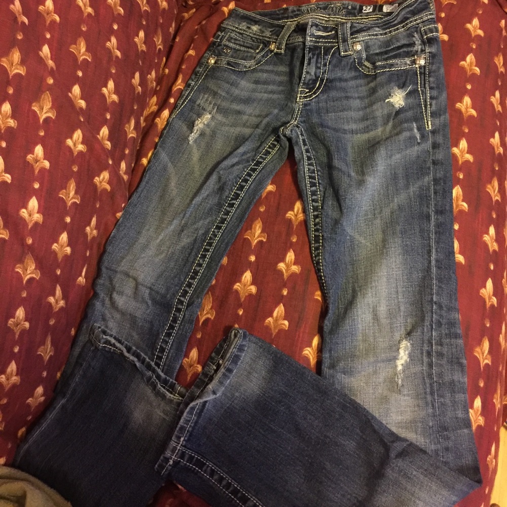 Distressed boot cut Miss Me jeans.