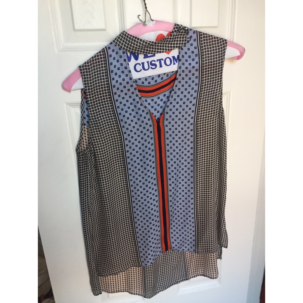 Silk sleeveless blouse with tab neck detail