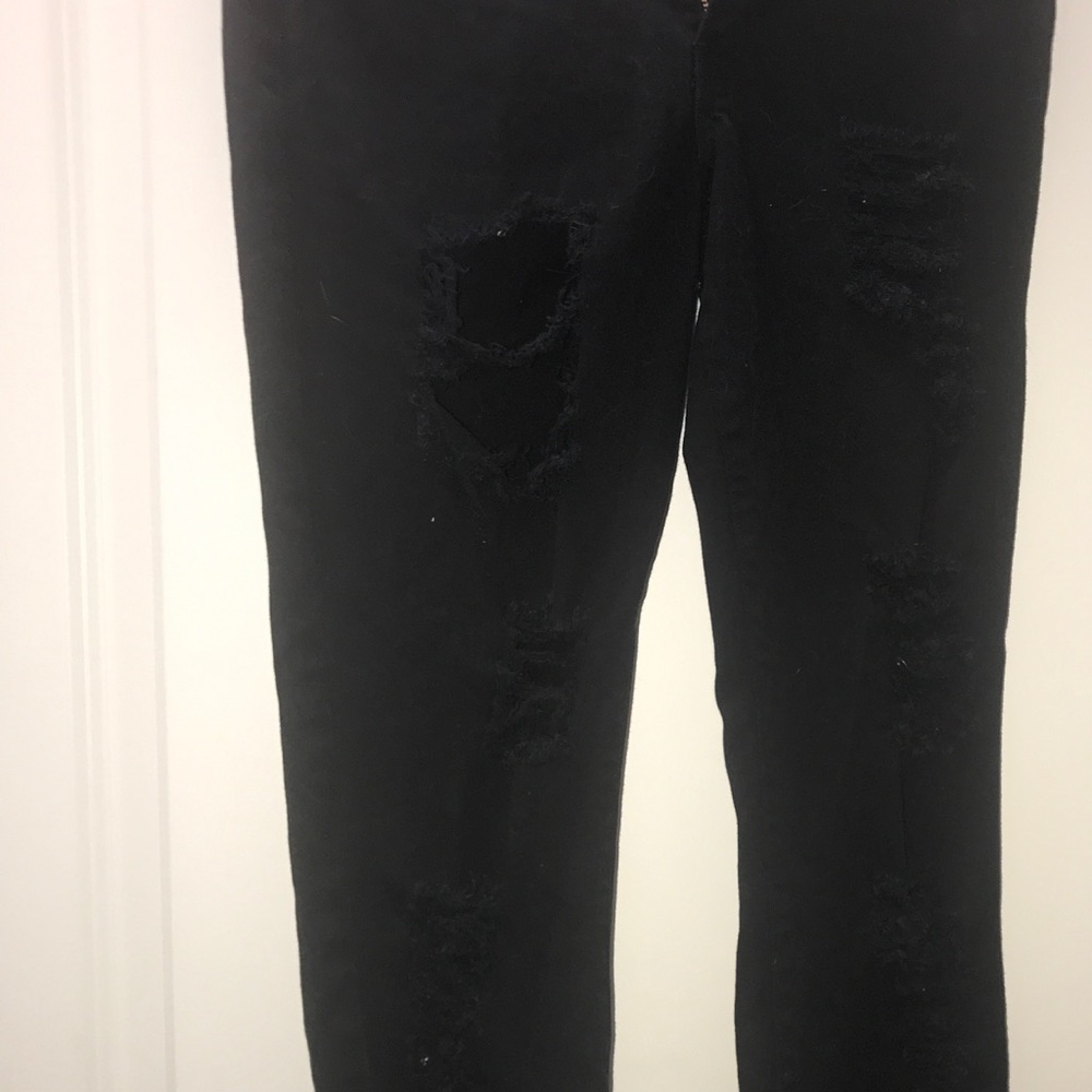 Super distressed black skinny jeans