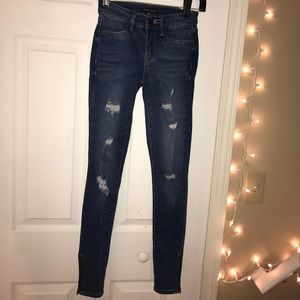 Distressed faded dark wash jeans