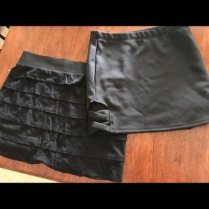 2 black mini skirts