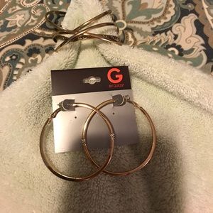 Gold earrings and bracelets from G by Guess