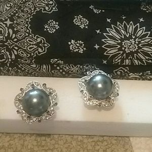 Joan Rivers pierced earrings.