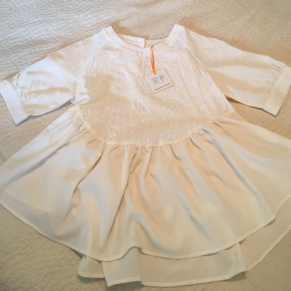 Orange Creek peplum top in cream