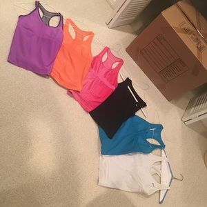 Six Nike workout tops