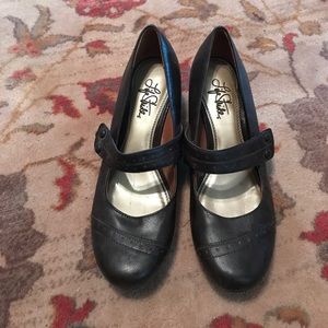 Brown heels with strap.