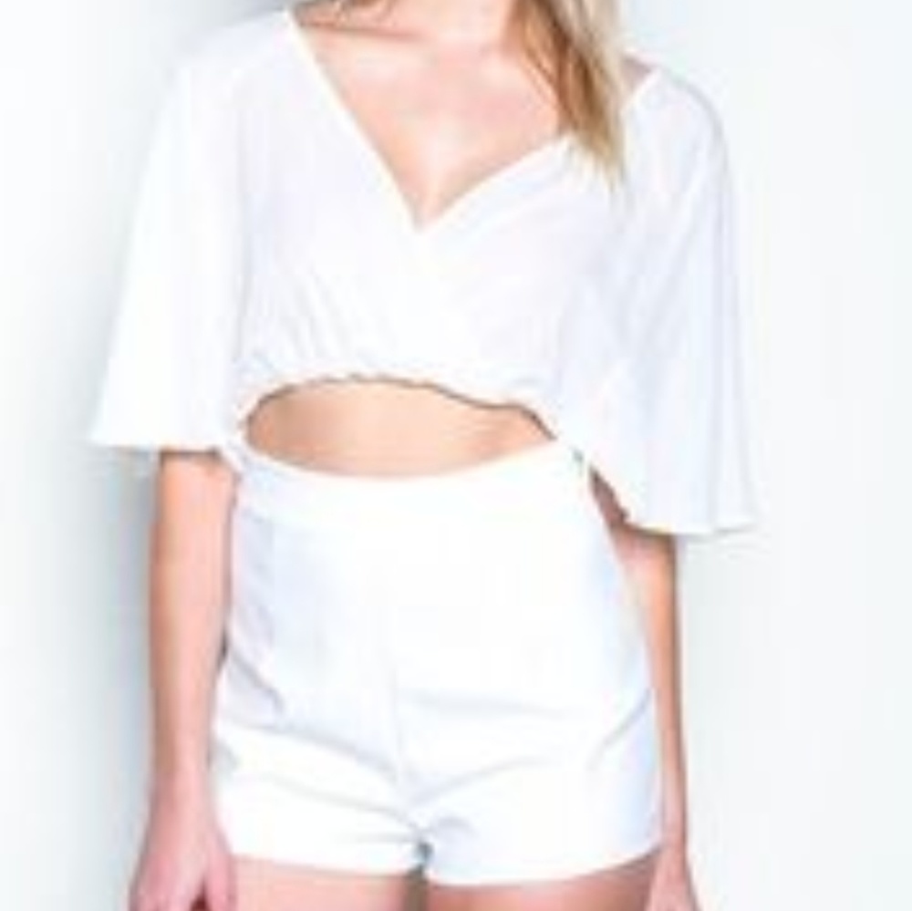 White cut out bell romper from love culture