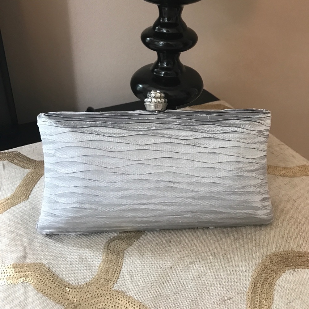 Silver hardshell clutch