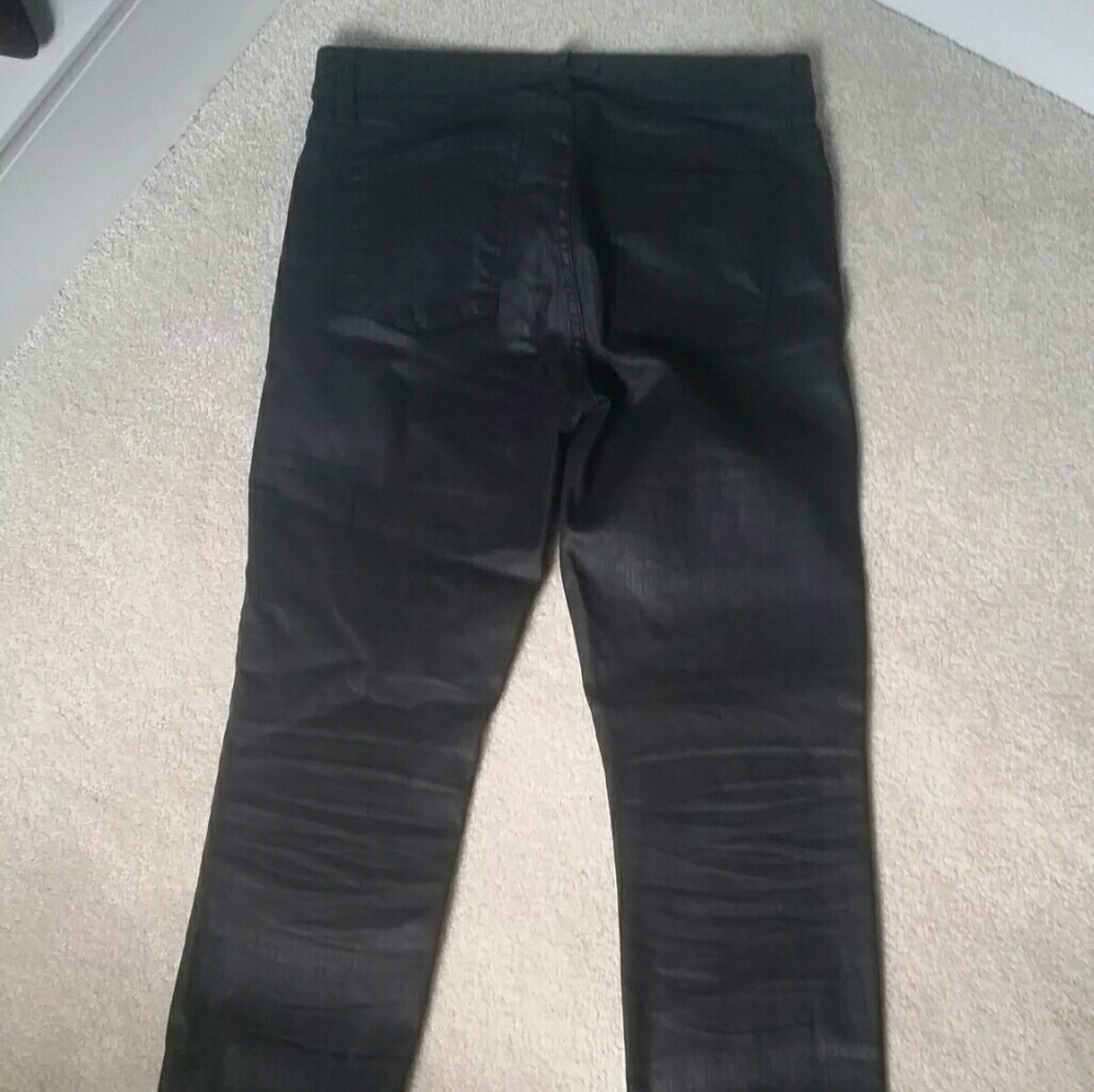 Coated black skinny jeans