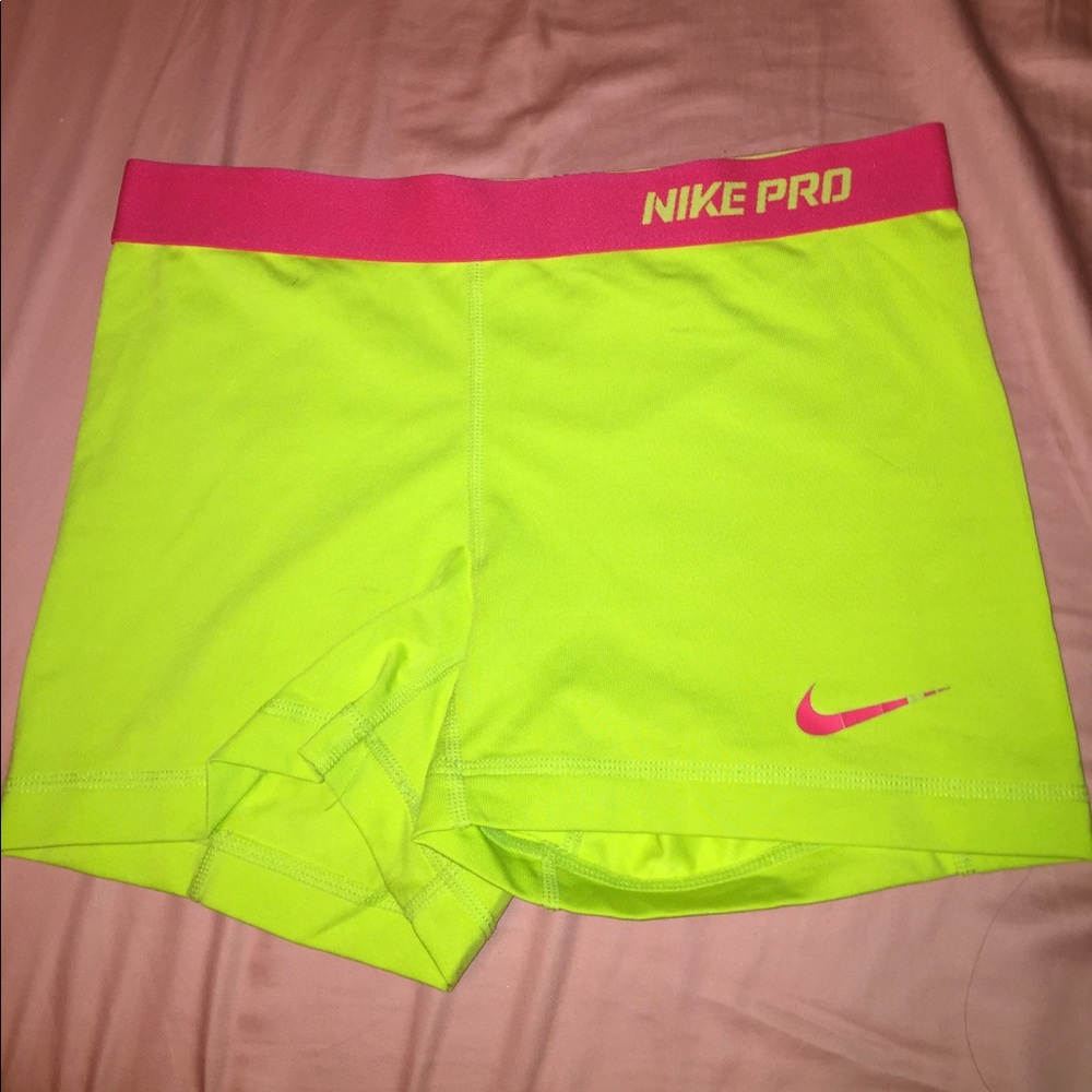 Yellow and pink Nike Pros