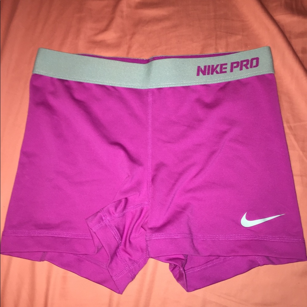 Purple and blue Nike pros