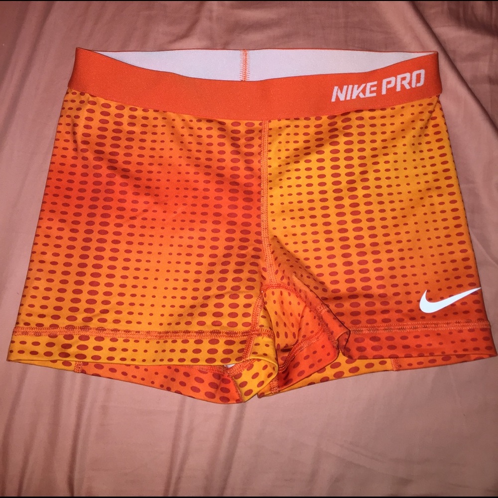 Orange patterned Nike Pros