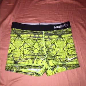 Neon greenish yellow Nike Pros