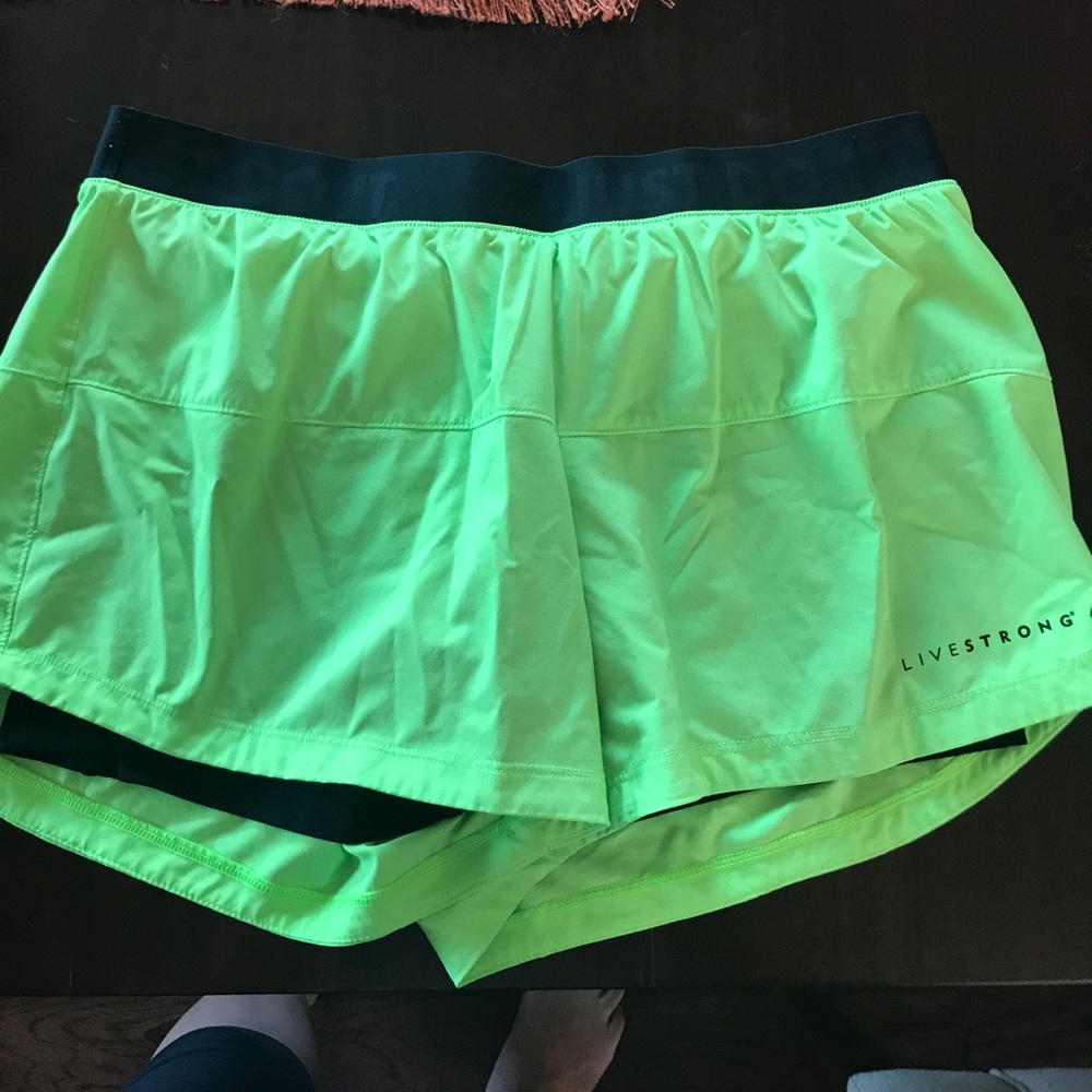Lime green Nike running shorts