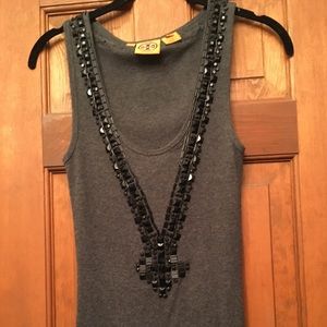 Studded top with intricate design