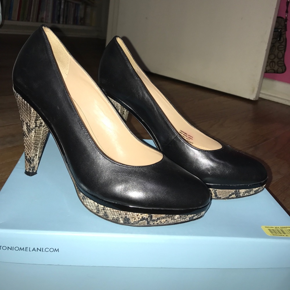 Black leather heels with snake skin accents
