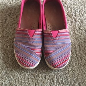 Hot pink TOMS with multi color strips
