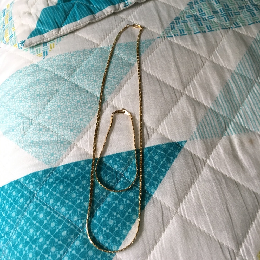 Gold chain with matching bracelet.
