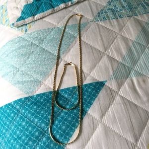 Gold chain with matching bracelet.