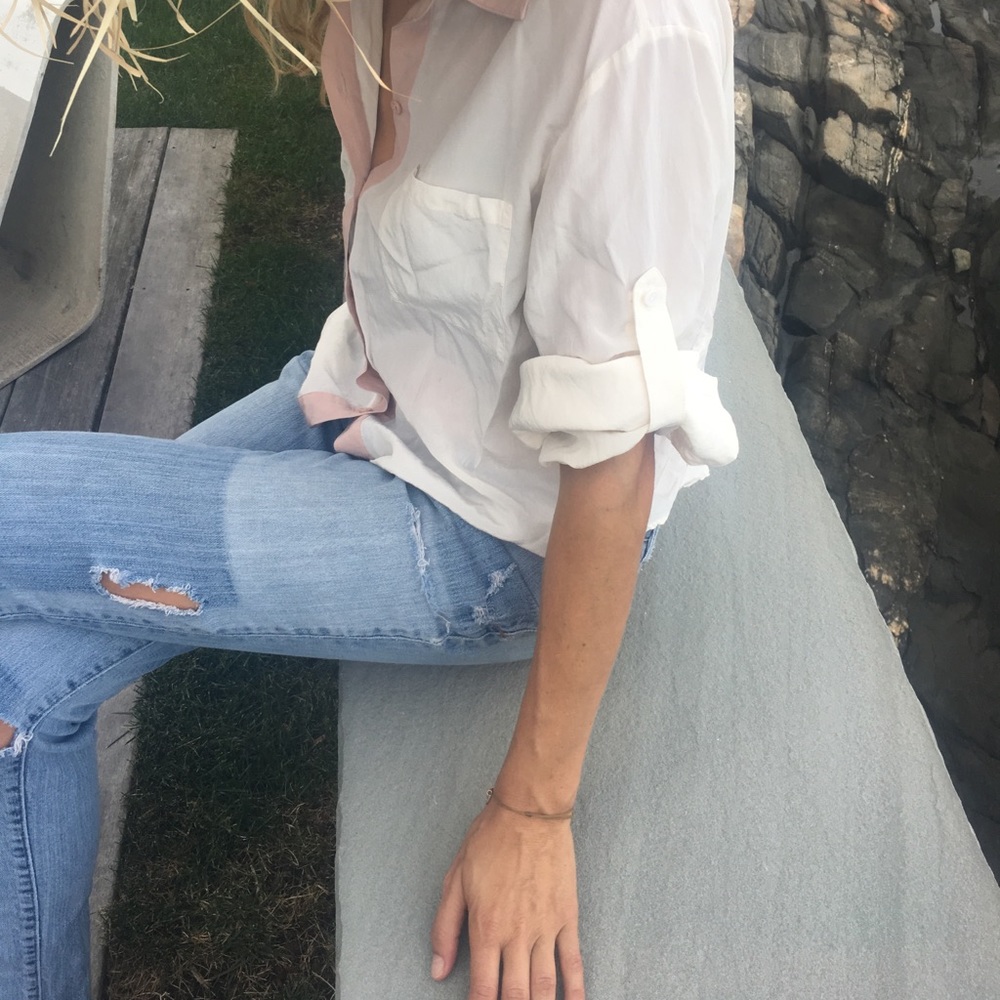 White, button down top, with peach stripe.