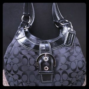 Coach black on black signature bag.