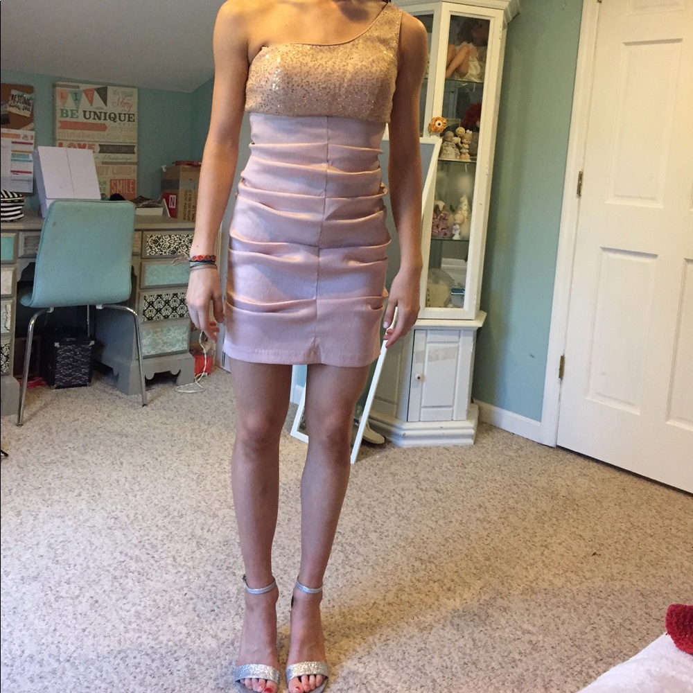 Light pink ruffle dress with gold sequince on top