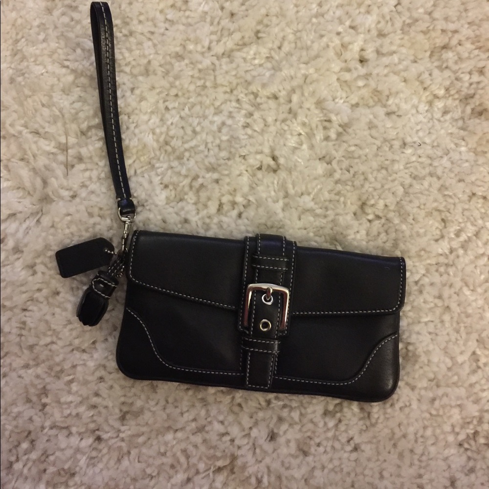 Deep navy wristlet with silver accents.