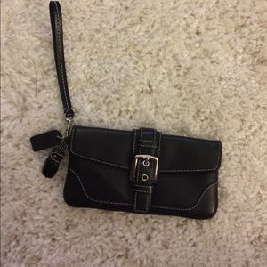 Deep navy wristlet with silver accents.