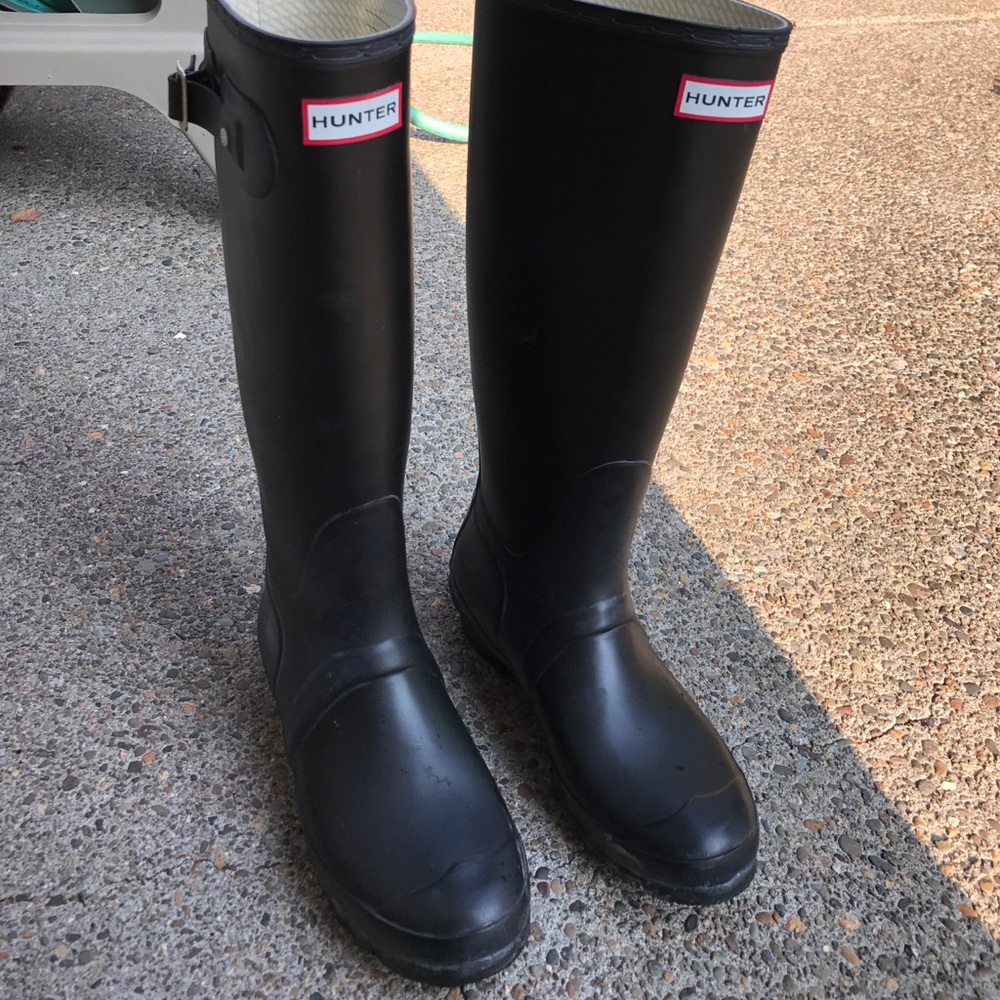 Black tall hunter boots