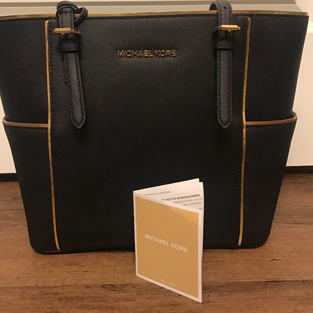Black and gold lined Michael Kors tote
