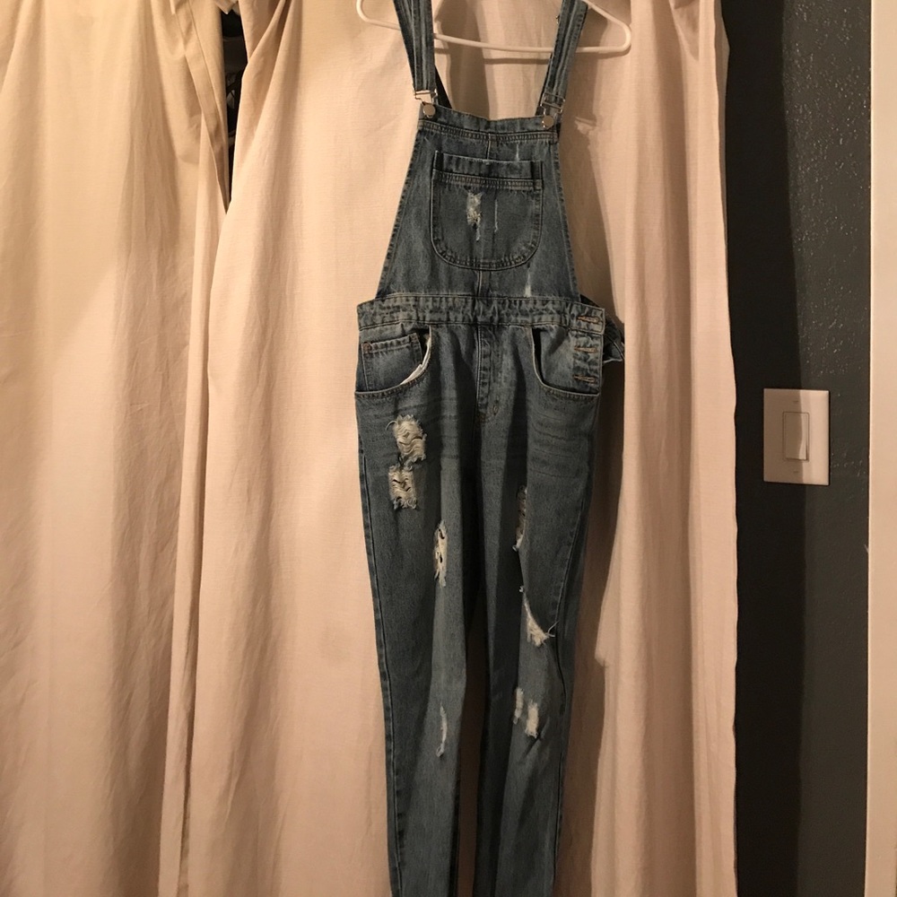 Ripped jean overalls