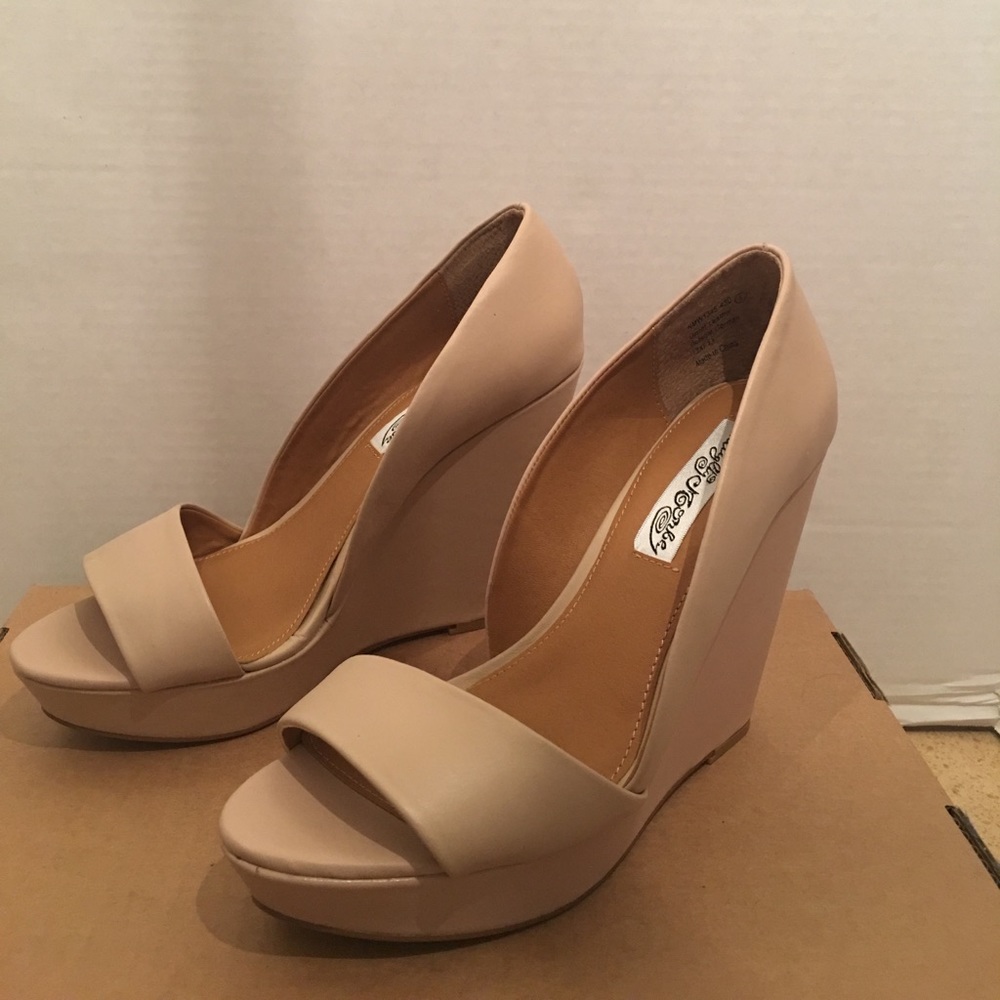 Never worn. Beige platforms.