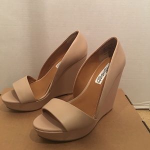 Never worn. Beige platforms.