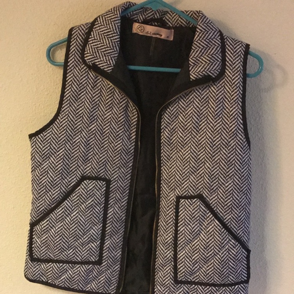Black & white vest.