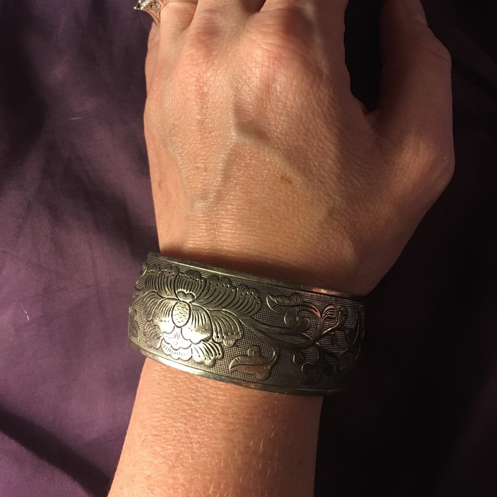 Silver cuff bracelet with floral design