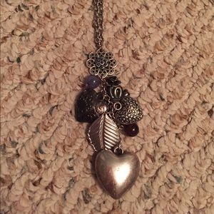 Long silver chain necklace w/ charms at the bottom