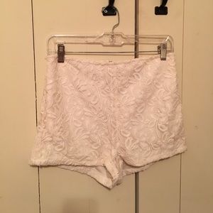 High-waisted white lace shorts