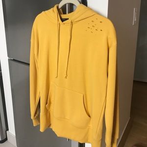 Yellow hoodie with distressed shoulder