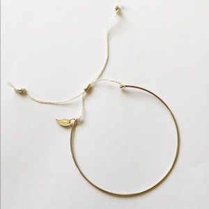 Boho feather detail gold and white bracelet