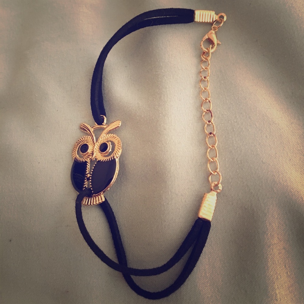 Suede-like owl bracelet.
