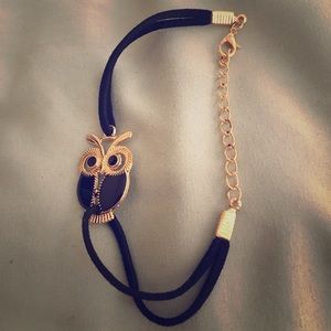 Suede-like owl bracelet.