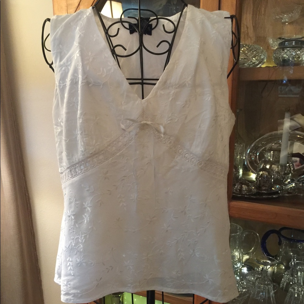 White sleeveless top