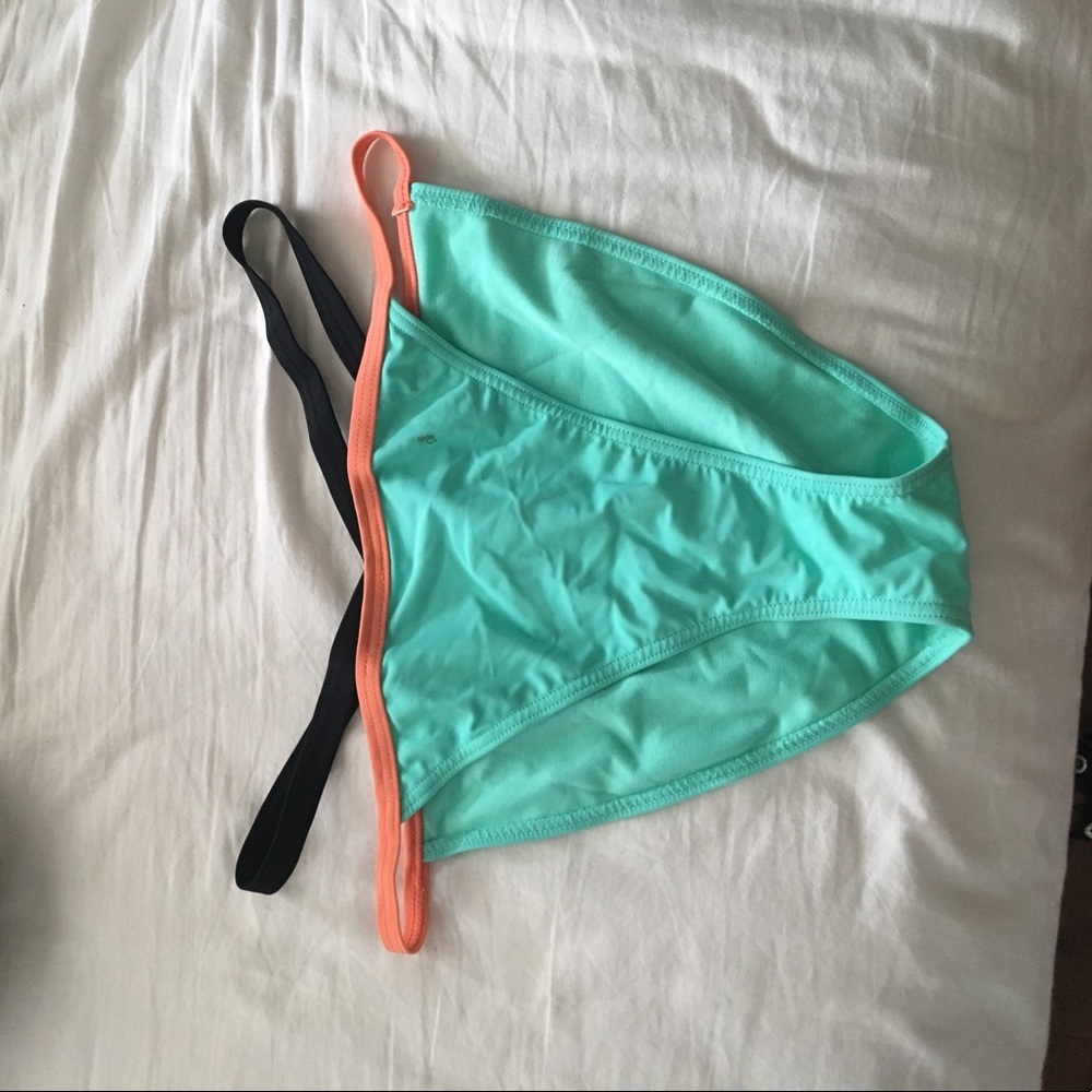 Blue bathing suit bottoms w/ pink and black straps