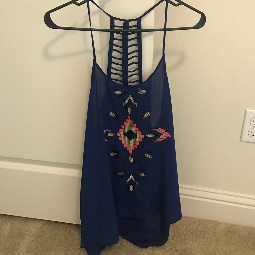 Blue tank with sequin detail and criss cross back